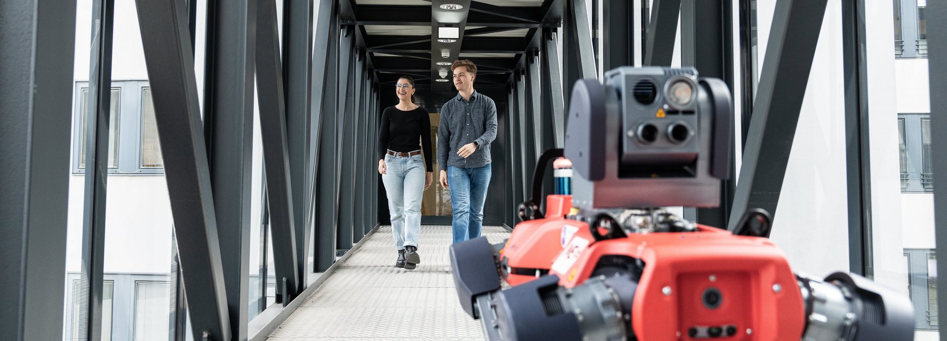 Students with a robot in the corridor of Technical University.