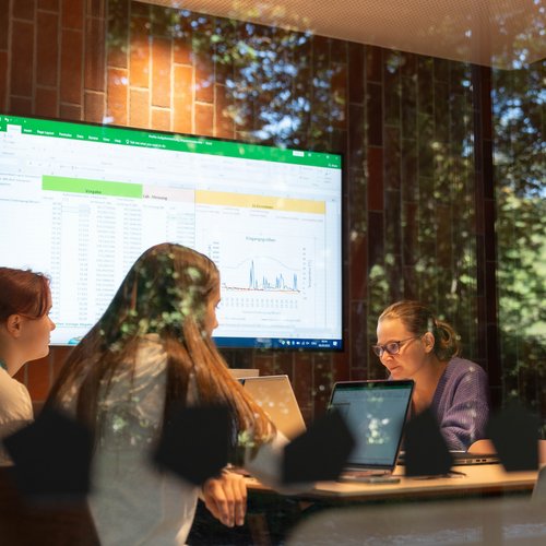 A small group of young people are studying in a room at the university.