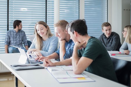 Students in the lecture hall with their laptops