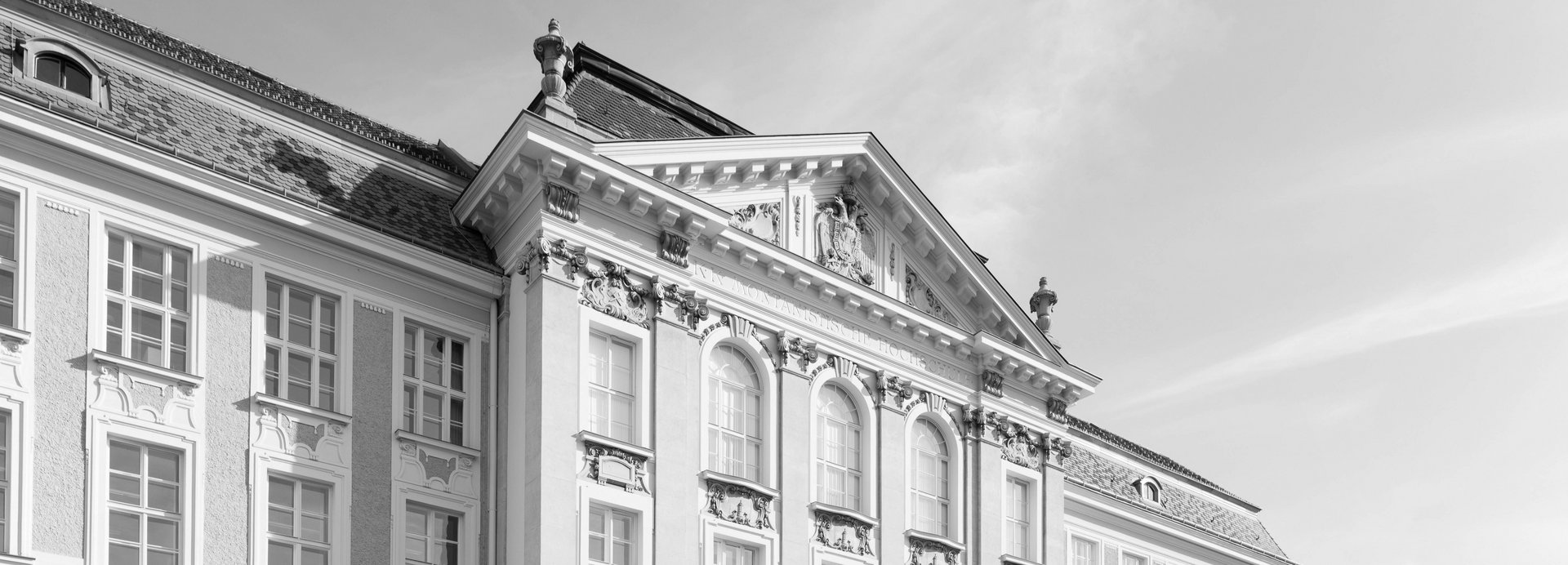 Main building of the Montanuniversität in black and white.