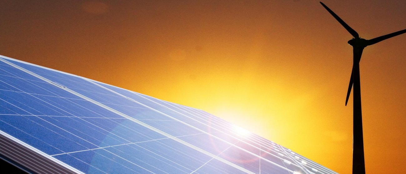 Photovoltaic panels and a wind turbine.