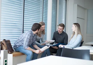Students studying and consulting.