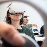 Student wearing virtual reality glasses.